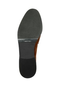 Suola di scarpa in pelle scamosciata marrone con una parte inferiore in gomma nera testurizzata, caratterizzata dal logo "Vibram" e un design a punta arrotondata.