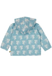 Giacca impermeabile azzurra chiara con un motivo ripetuto di koala bianchi, cappuccio, polsini elastici e un taglio dritto all'orlo.