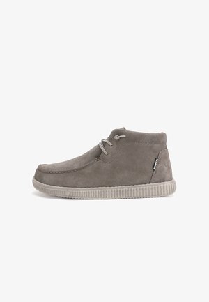 Gray suede ankle boots with round toe, contrasting cream textured rubber sole, and lace-up design with visible stitching details.