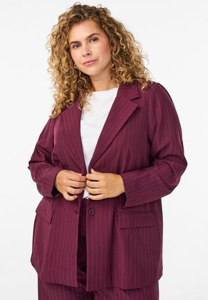Maroon pinstriped blazer with a relaxed fit, notched lapels, front pockets, and single button closure, paired with a white top.