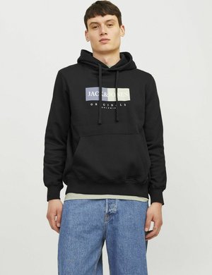 Black hoodie with a front pocket and drawstring hood. Features a multicolored logo print. Worn over a light-colored t-shirt and blue jeans.
