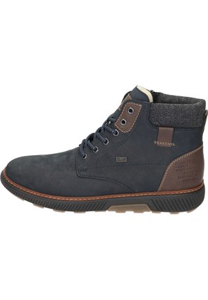 Stivaletto alla caviglia in pelle blu scuro con dettagli in pelle marrone, colletto in tessuto grigio, chiusura con lacci e suola in gomma con motivo antiscivolo.