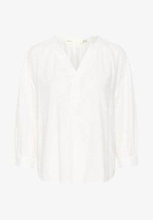 Biała bluzka z dekoltem w kształcie litery V, z rękawami o długości trzech ćwiartek i marszczonymi detalami. Wykonana z lekkiego materiału o gładkiej fakturze.