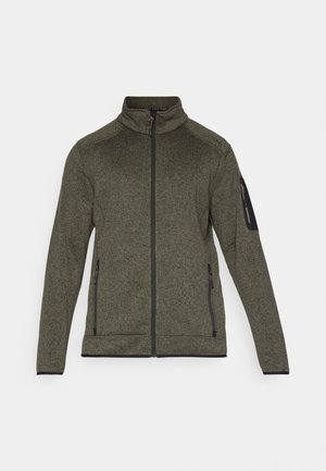 Olivgrüne Zip-Jacke aus strukturiertem Stoff, mit seitlichen Taschen und einem schwarzen Akzent an den Ärmeln. Hoher Kragen und taillierte Passform.