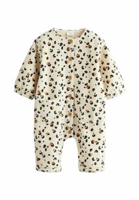 Combinaison en coton crème avec un motif rayé texturé, ornée de taches marron et noires, à manches courtes, avec des boutons et deux poches avant.