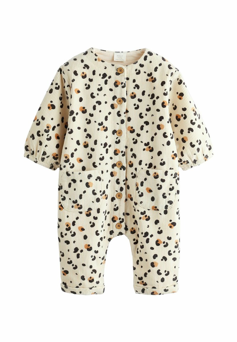 Combinaison en coton crème avec un motif rayé texturé, ornée de taches marron et noires, à manches courtes, avec des boutons et deux poches avant.