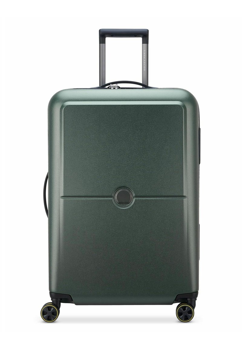 Valigia rigida di colore verde scuro. Presenta una finitura testurizzata, manico retrattile, due ruote con accenti gialli e un meccanismo di chiusura centrale.