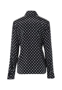 Black satin shirt with white polka dots, long sleeves, pointed collar, and buttoned cuffs. Smooth texture with a glossy finish.