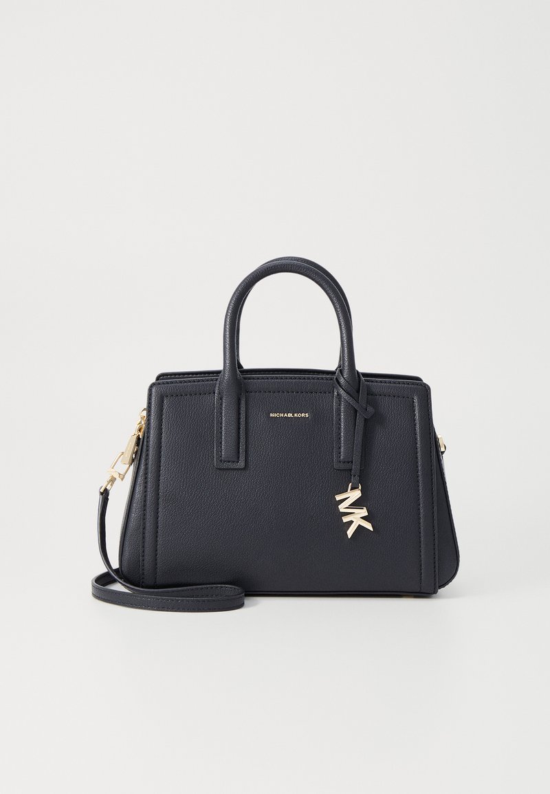 Bolsa em pele azul marinho com duas alças superiores, correia de ombro destacável, acessórios em tom dourado e um encantador logo MK. Forma retangular.