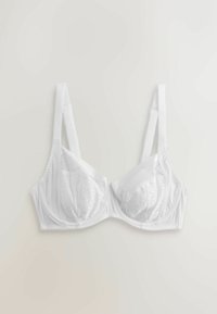Soutien-gorge blanc avec bonnets en dentelle, bretelles réglables et base en tissu lisse. Conçu avec une forme sans coutures et une texture douce pour le confort.