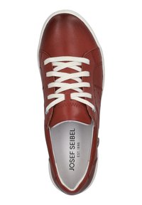 Ruskean nahkakengät valkoisilla nauhoilla, pyöreällä varpaalla, reikäkuvioinnilla sivuilla ja valkoisella kumipohjalla. Brändäys näkyvissä sisäpohjassa.