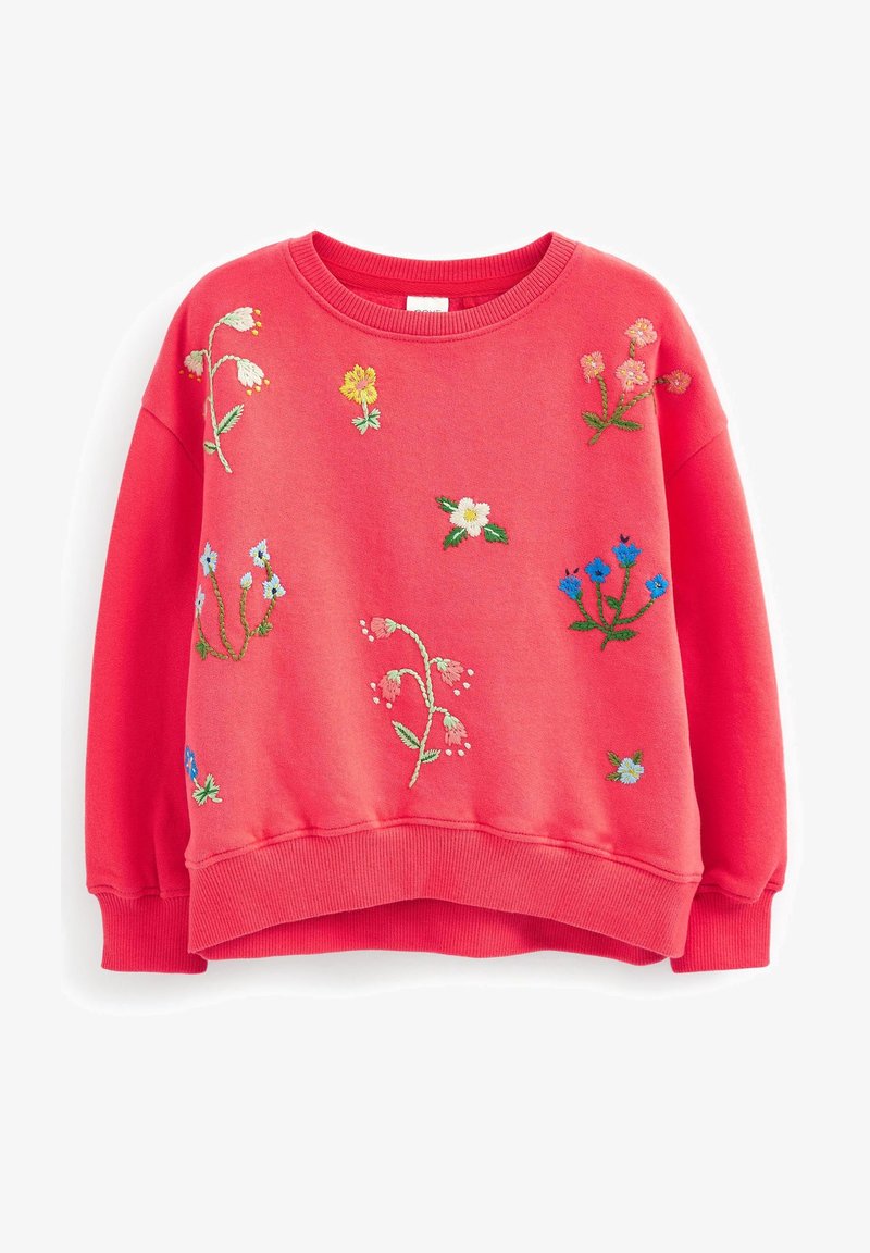 Sweat-shirt rouge avec des fleurs brodées de différentes couleurs. Encolure ronde, poignets et ourlet côtelés. Tissu doux avec une coupe décontractée.