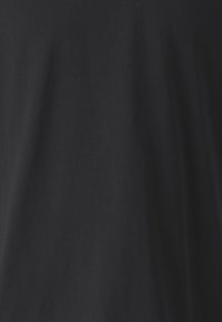 Black cotton fabric with a smooth texture, featuring minimal wrinkles and no visible patterns or accents, displaying a solid color.