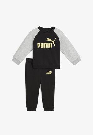 Black and gray children's tracksuit made of cotton blend, featuring a black long-sleeve top with yellow "PUMA" logo and matching black pants.