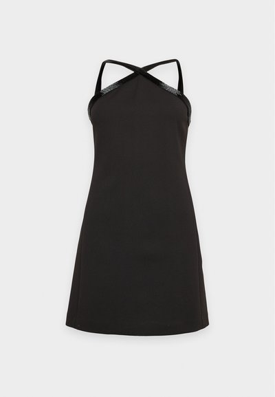 Robe noire sans manches avec un bustier ajusté, un ourlet évasé et de fines bretelles croisées.