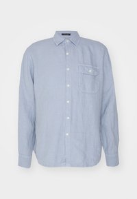 Camicia azzurro chiaro a maniche lunghe con taschino sul petto e colletto classico, realizzata in tessuto testurizzato.
