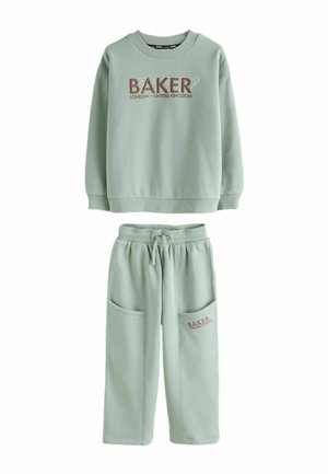 Light green sweatshirt and pants set with "BAKER London United Kingdom" text on chest and pocket, featuring drawstring waist and large front pockets.