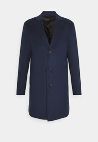 Cappotto in misto lana blu navy con rever a lancia, chiusura con un bottone e fodera interna liscia in satin. Caratterizzato da due tasche laterali e una vestibilità sagomata.