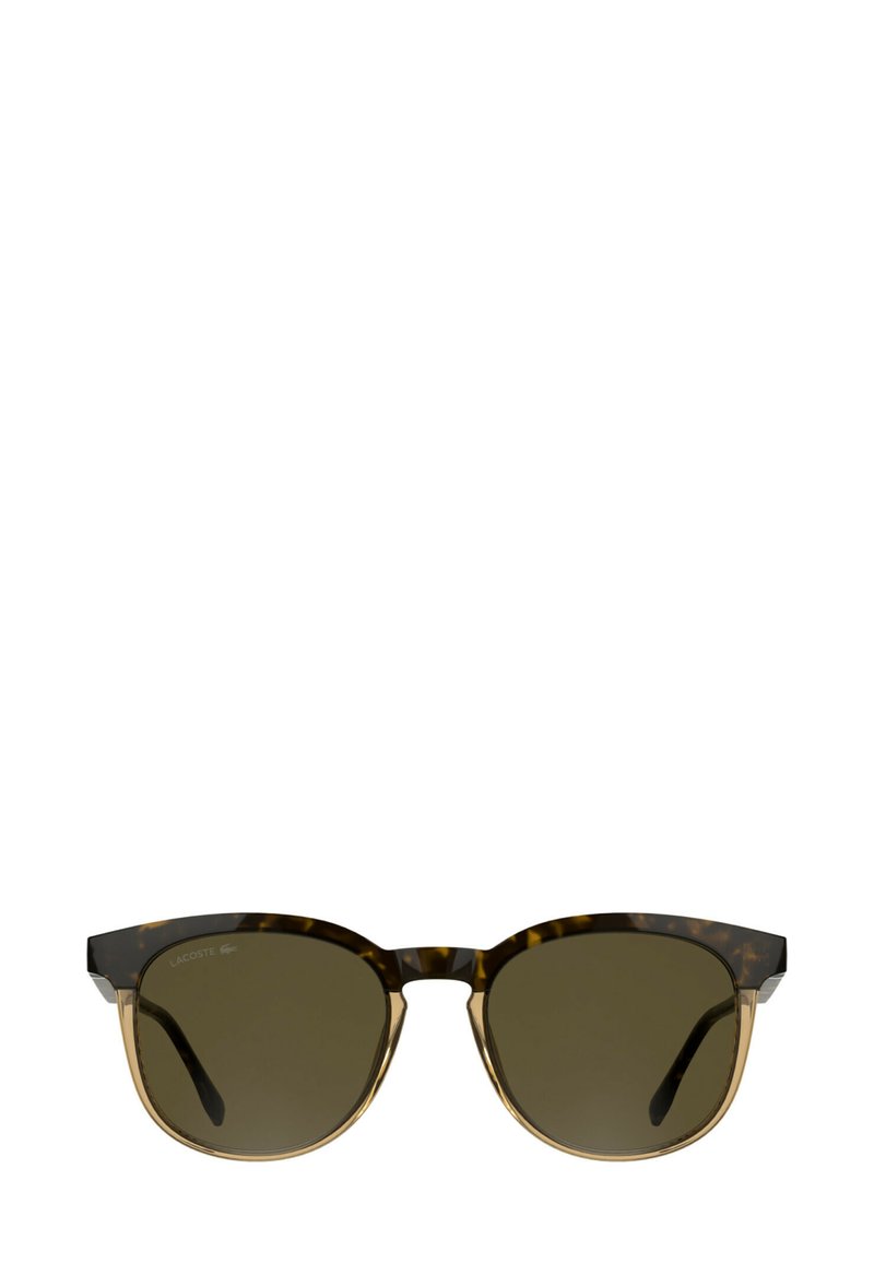 Occhiali da sole tartarugati con montatura a forma di occhi di gatto, lenti verdi scure e dettagli trasparenti marroni sulle aste, con branding discreto.