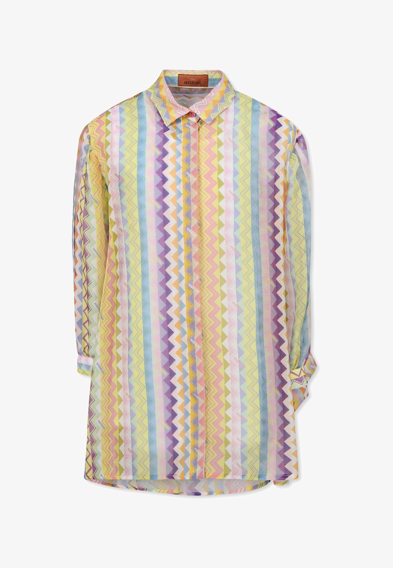 Nööpidega särk, millel on erksad zigzag-mustrid pastelltoonus kollases, roosas ja sinises. Valmistatud kergest kangast, klassikalise kraega.