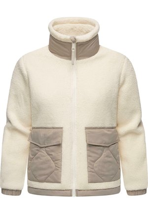 Veste en polaire couleur crème avec un col montant, fermeture éclair à l'avant et deux poches en patch beige avec un design matelassé. Poignets et ourlet élastiques.