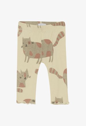 Leggings in lichtbeige met een kattenontwerp en roze accenten. Zachte stof, getailleerd ontwerp en ruches aan de zoom.
