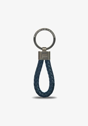 Porte-clés en cuir avec un design tressé bleu marine, doté d'un anneau en métal et d'un accent argenté avec le logo Porsche Design.