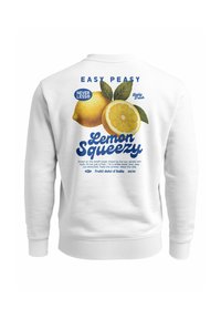 White sweatshirt featuring "Lemon Squeezy" graphic with lemons, leaves, and text in blue. Ribbed cuffs and hem, soft texture, casual design.