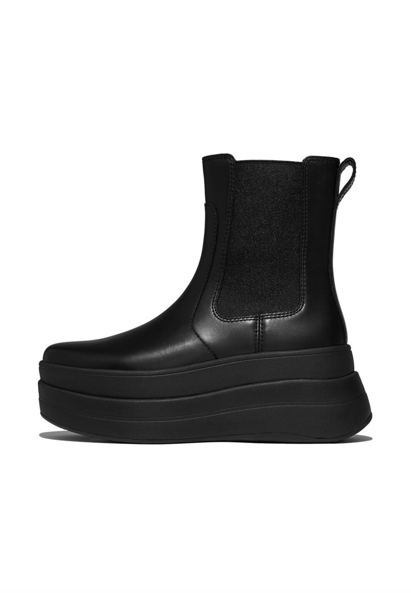 Black platform ankle boot made of smooth leather with elastic side panels, rounded toe, and a chunky rubber sole.