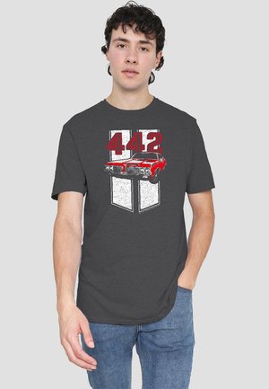 Gray t-shirt featuring a graphic of a red car and "442" text in red and white. The design is set against a textured background.