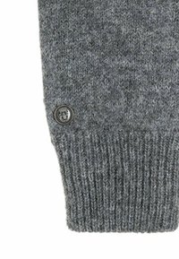 Gray knitted sweater cuff featuring a ribbed texture and a branded button with an emblem. Soft wool-like material.