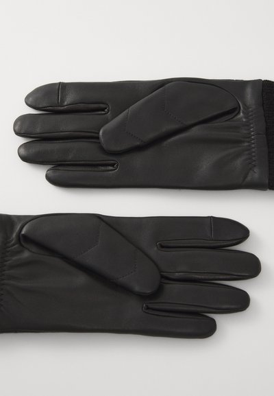 Sorte læderhandsker med slankt design, der har syet polstring på bagsiden, elastisk håndled for en tætsiddende pasform og let tekstureret finish.