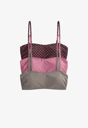 Three women's cropped tank tops with thin straps stacked vertically; top is brown with white polka dots, middle pink, bottom gray ribbed fabric.