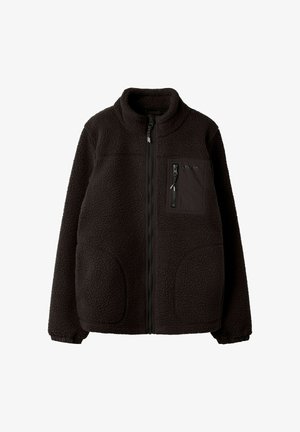 Juodas pilnai užsegamas fliso švarkelis su stovu apykakle, elastinėmis rankogaliais, dviem priekinėmis kišenėmis ir užtrauktuku užsegama krūtinės kišene su audinio detalėmis.