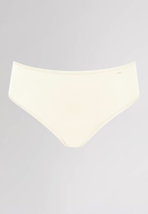 Beige kvinders trusse med en glat tekstur, medium højde design og elastisk talje. Minimal branding nær taljen.