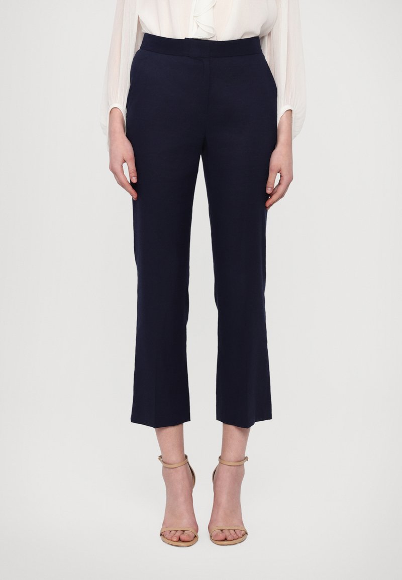 Navy tailored trousers with a high waist and cropped, straight legs. Made from a smooth fabric, featuring no visible patterns or embellishments.