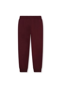 Pantalons de survêtement bordeaux en tissu doux, avec une taille côtelée, des jambes fuselées et des bords élastiques aux chevilles. Design minimaliste.