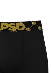 Fekete boxer alsónadrág, széles fekete derékrésszel, amelyen sárga "PSD" logó és kör alakú mintázat található. Súlyos, sima anyag, mely szoros illeszkedést biztosít.
