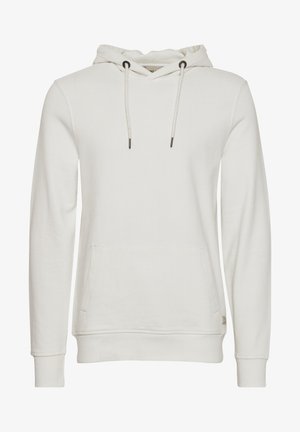 Jasnobeżowa bluza z kapturem wykonana z miękkiego materiału, z przednią kieszenią, kapturem z sznurkiem zakończonym czarnymi końcówkami oraz ściągaczami przy rękawach i na dole.