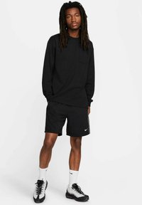 Nike Sportswear Pantaloni sportivi - schwarz