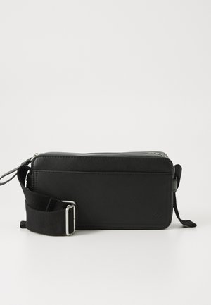 REMYY UNISEX - Cross body bag - black