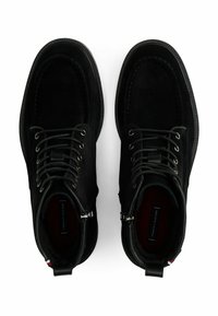 Pair of black suede lace-up ankle boots with side zippers, round toes, and branded insoles, viewed from above on a white background.