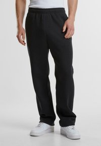 Urban Classics Tracksuit bottoms - black