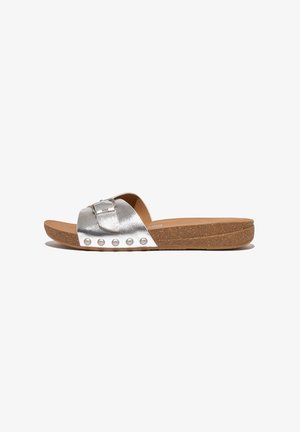 Silver metallic slide sandals with a wide strap, featuring a rectangular buckle and decorative stud accents on a cork sole.