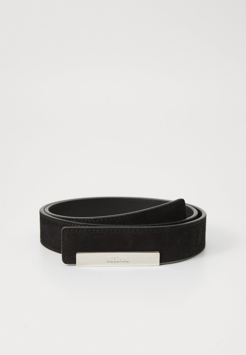 Black suede belt with a smooth leather interior. Features a metallic plate with embossed text, showcasing a minimalist design and clean lines.