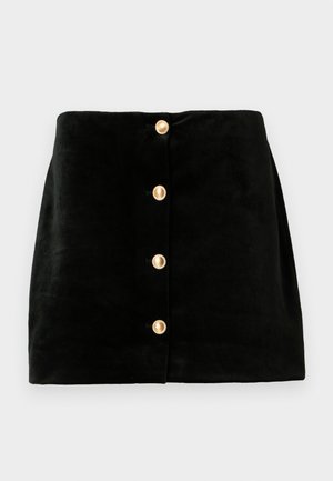 Mustast sametist mini seelik viie kuldse nupuga ees, millel on sile tekstuur ja struktureeritud kuju.