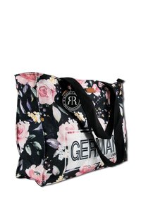 Large tote bag featuring a black floral pattern with pink roses, black handles, and a white "GERMAN" logo on the front. Textured fabric.