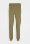 MICRO LOGO - Pantalones deportivos - delta green