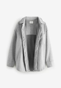Gray wool blend shirt jacket with a button-down front, two chest pockets, and a relaxed fit. Features a collar and knit texture.