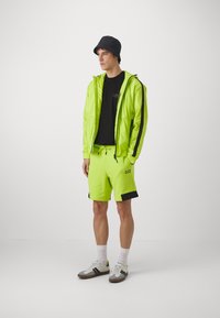 EA7 Emporio Armani Tracksuit bottoms - verde acido